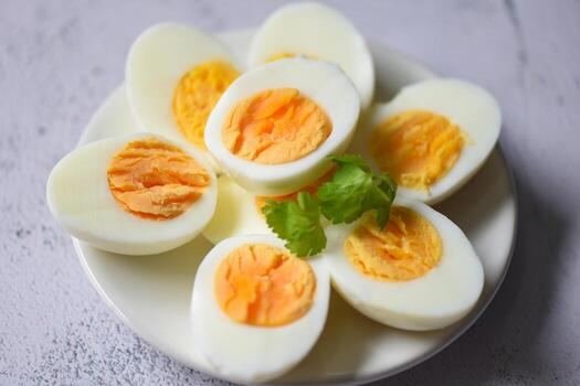 eggs-menu-food-boiled-eggs-in-a-white-plate-decorated-with-leaves-green-coriander-cut-in-half-egg-yolks-for-cooking-healthy-eating-eggs-breakfast-free-photo